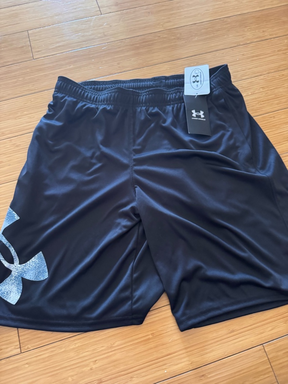 Under Armour youth black Athletic Shorts with Reflective Logo